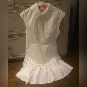 Milly white pleated bottom dress in white with gold detail buttons.